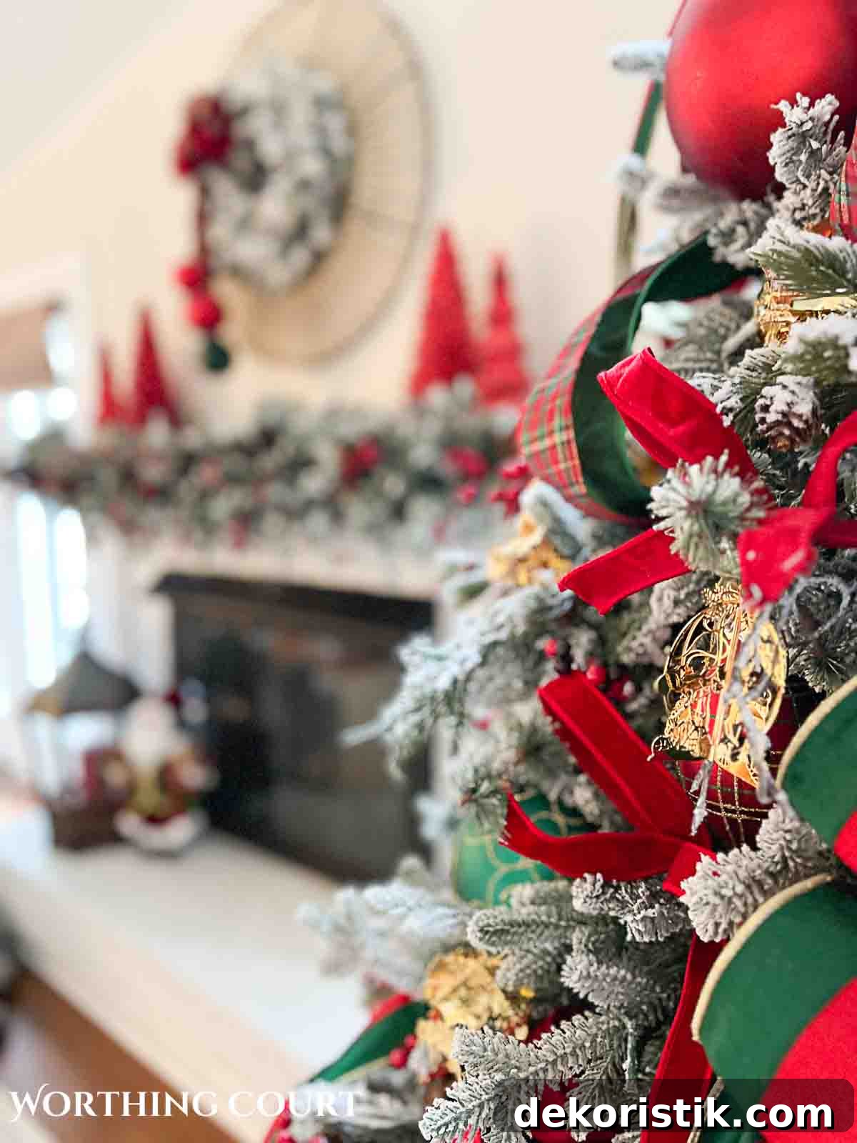 Christmas tree, fireplace and living room decorated for Christmas with red green and gold decorations