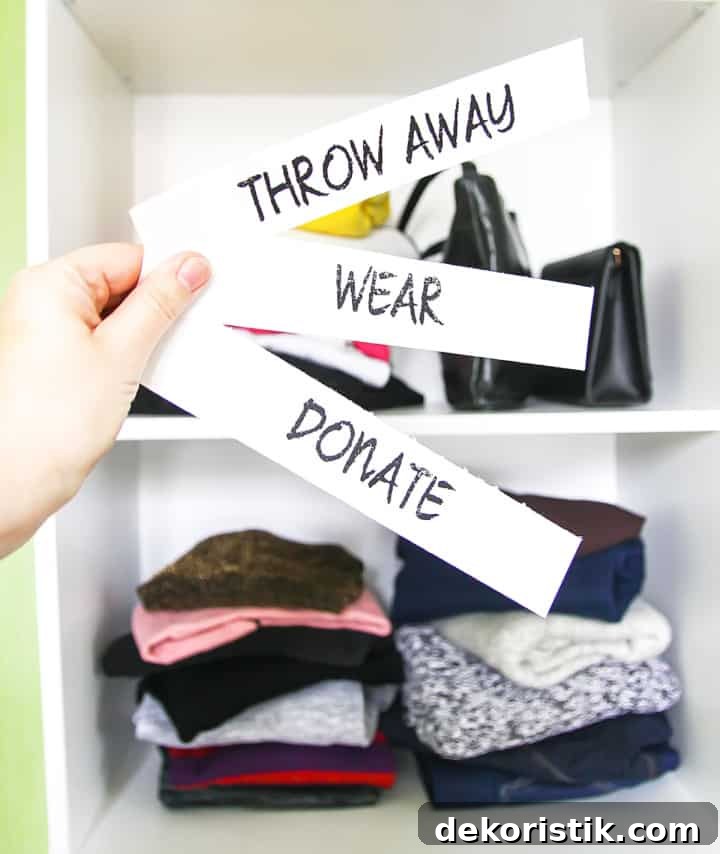 clothes in stacks of what to throw away, keep or donate before organizing a closet