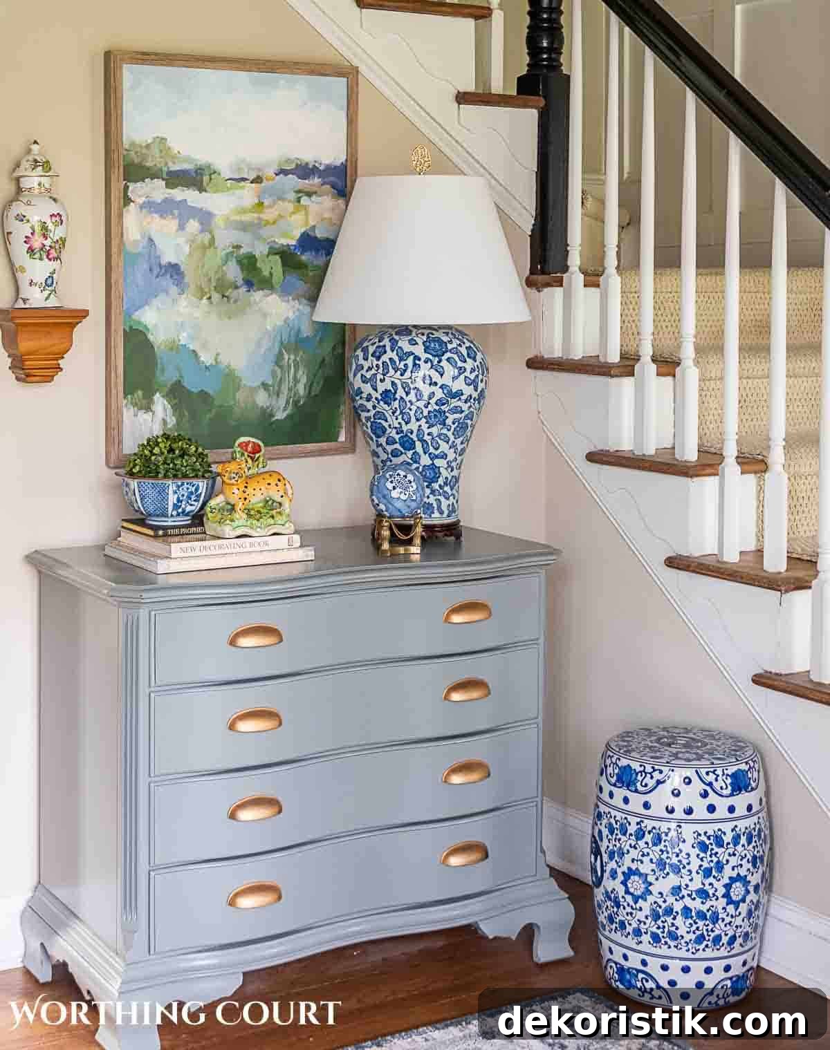 foyer with gray chest and spring decorations and greenery