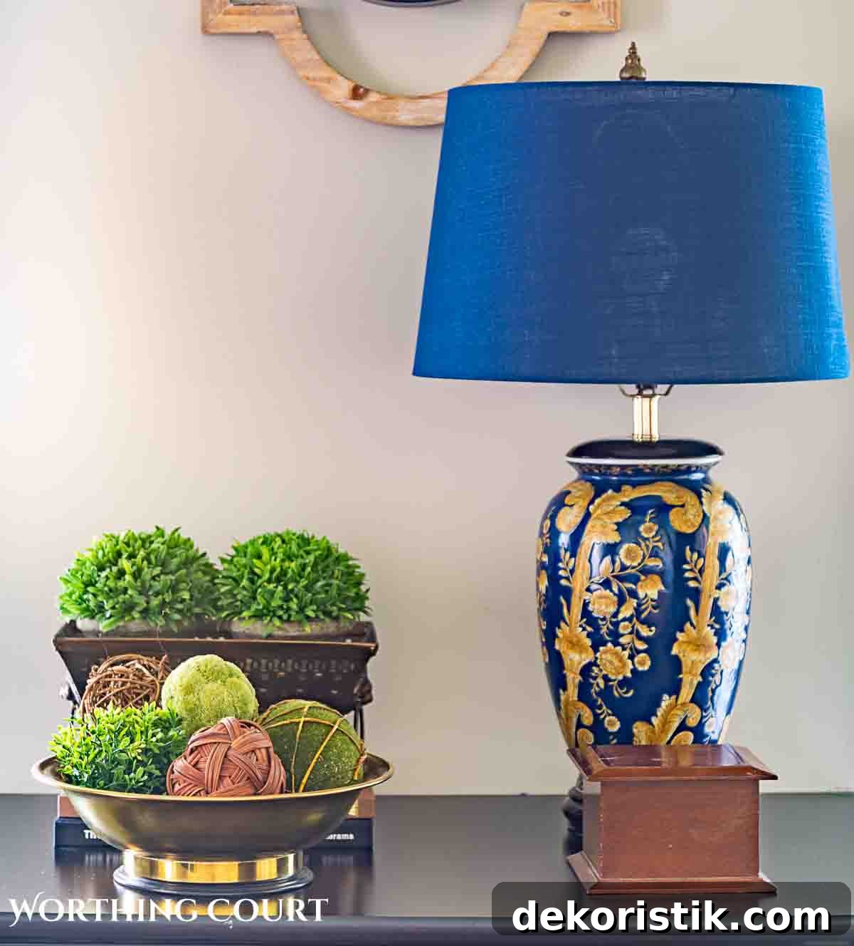 blue lamp greenery and other accessories on a black chest for spring