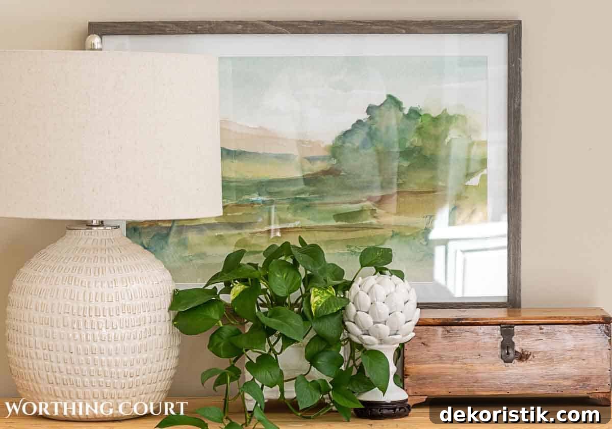 abstract wall art hanging above a console table
