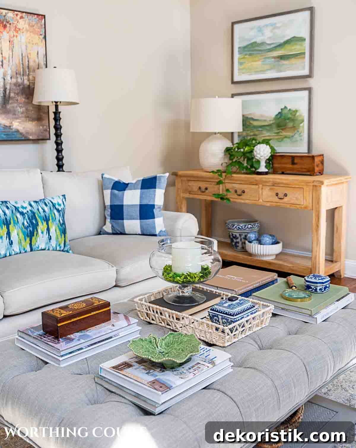 Stylish Living Room Wall Decor Ideas to Transform Your Space 2 living room with gray couch, upholstered coffee table, wall art above console table and accessories