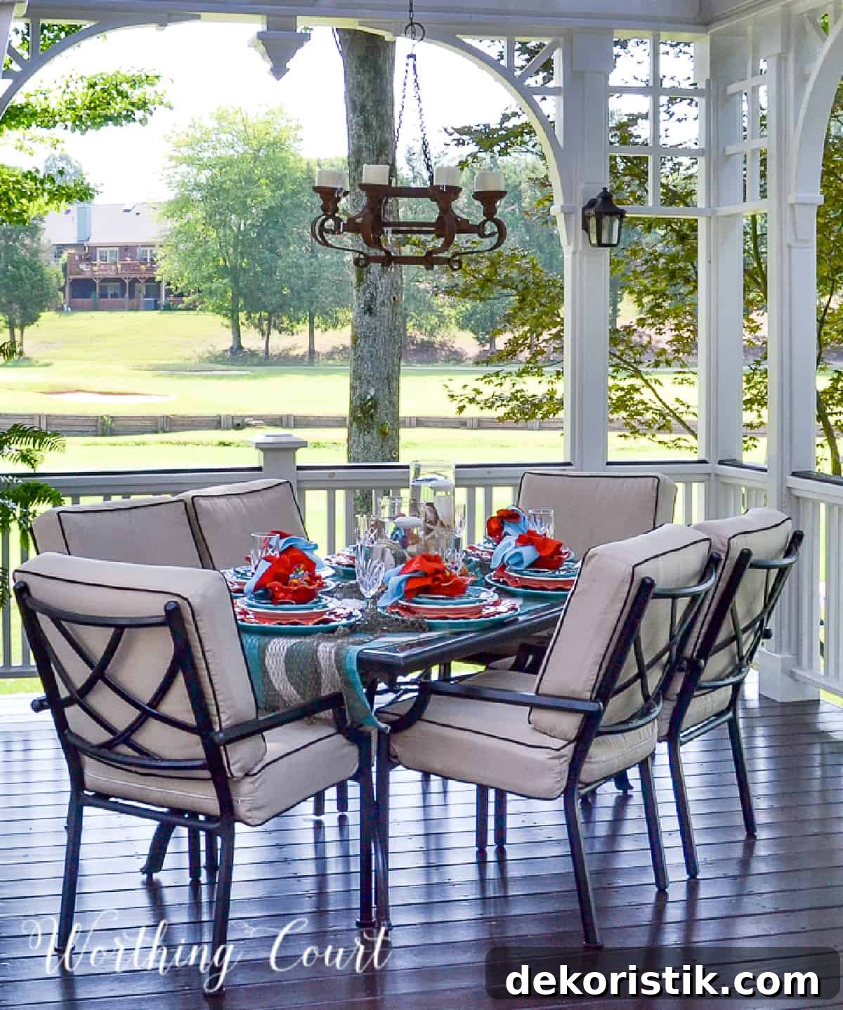 outdoor dining area on a deck with a turquoise and coral tablescape