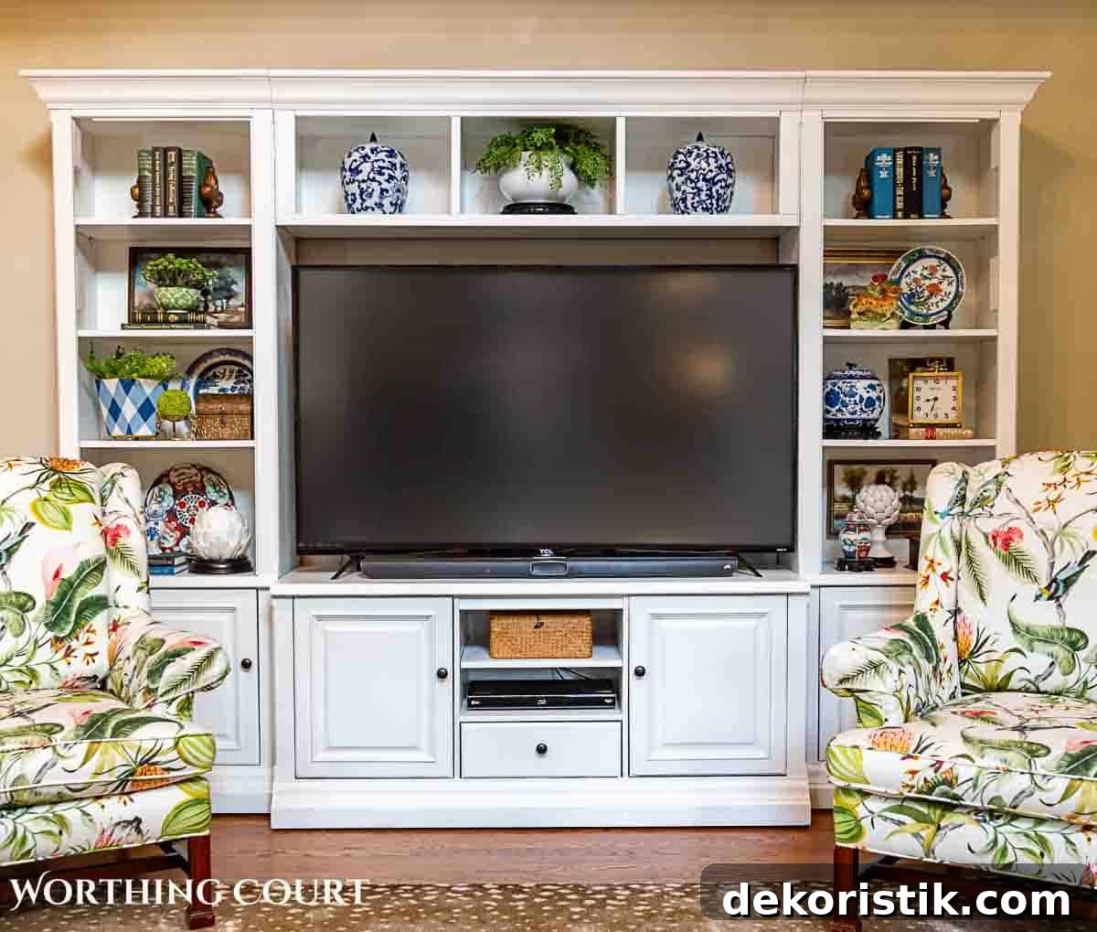 white entertainment center decorated with accessories