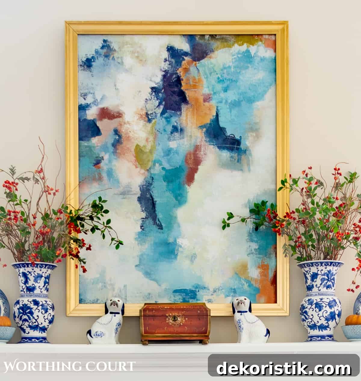 abstract art and blue and white accessories on a mantel