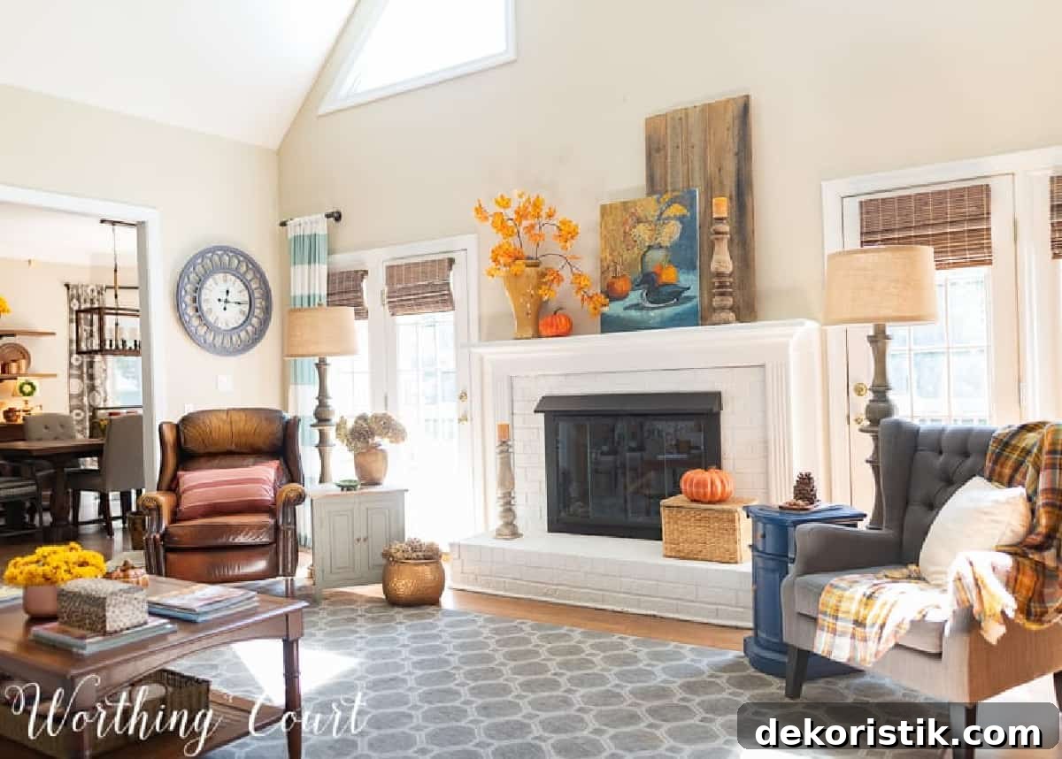 fall decorations on a white brink fireplace and mantel