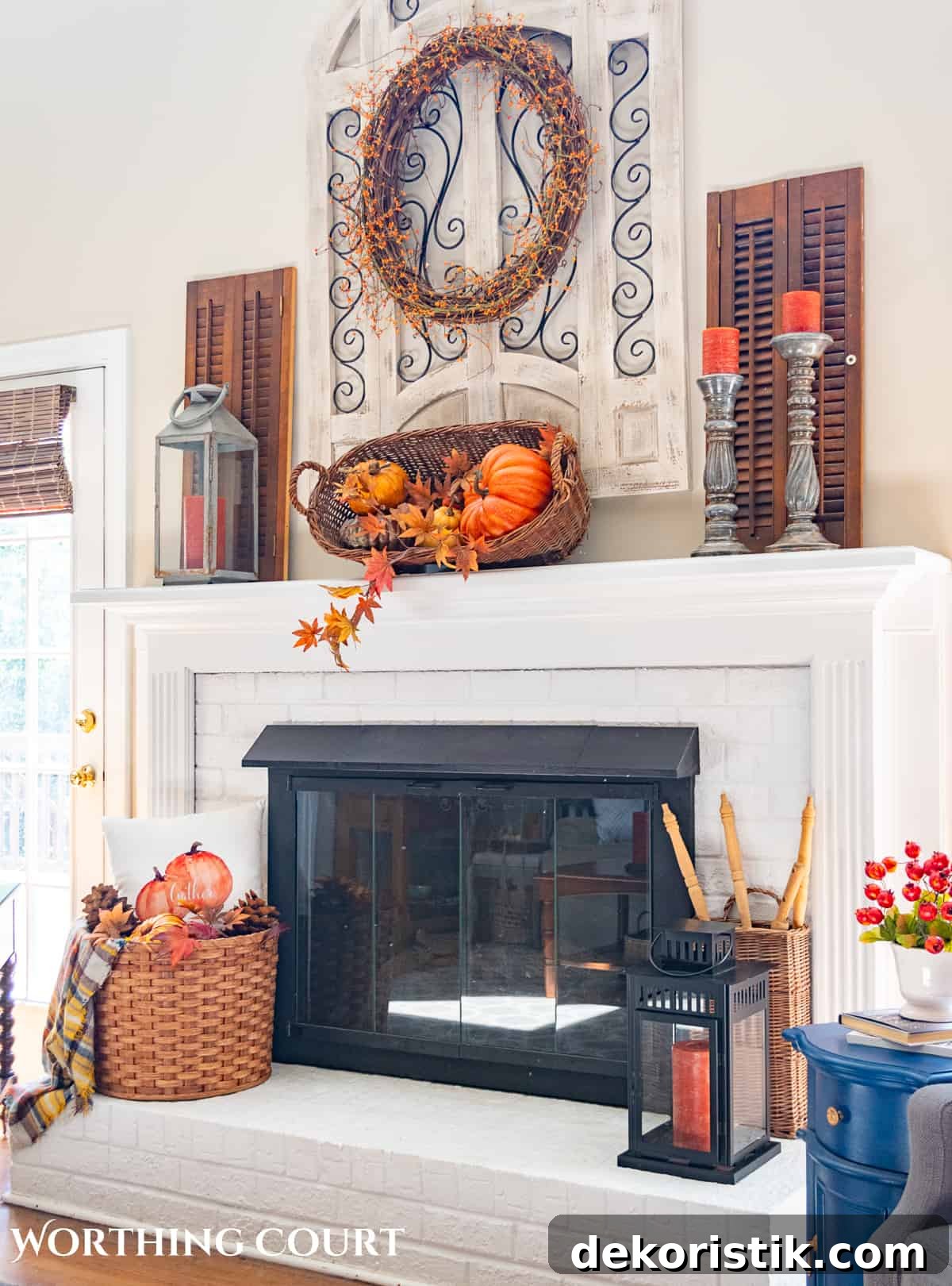 fall decorations on a white brink fireplace and mantel
