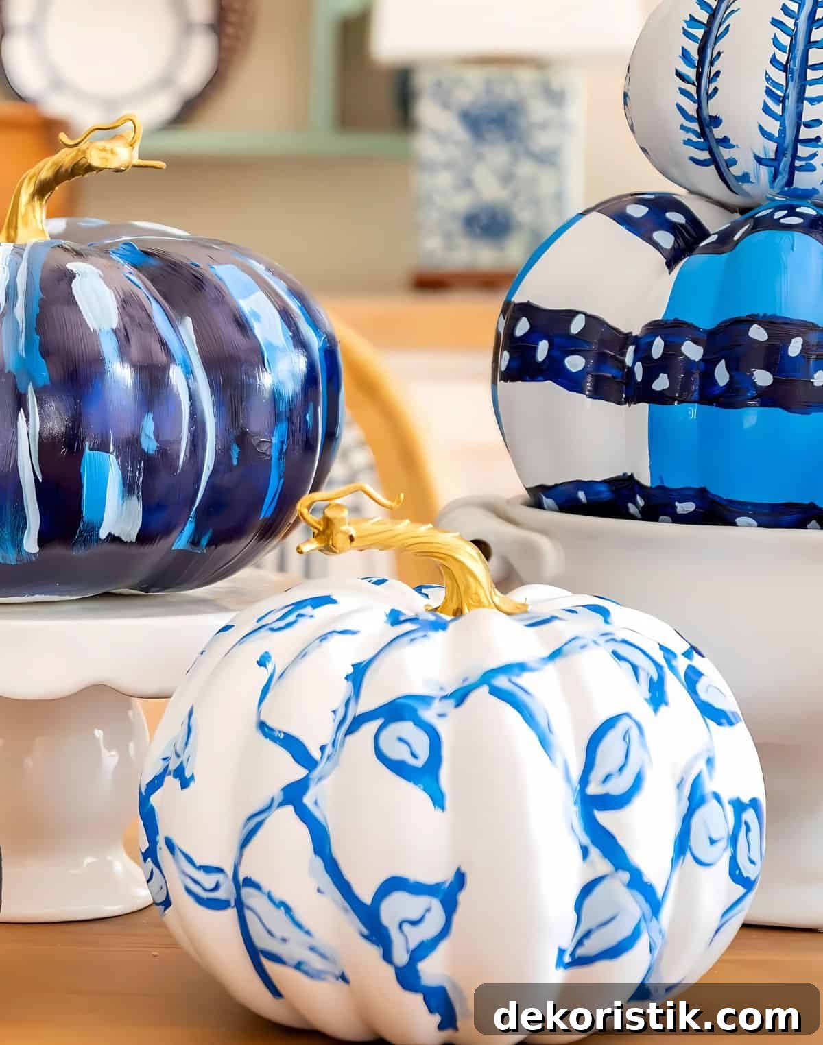 blue and white DIY painted pumpkins used as a centerpiece