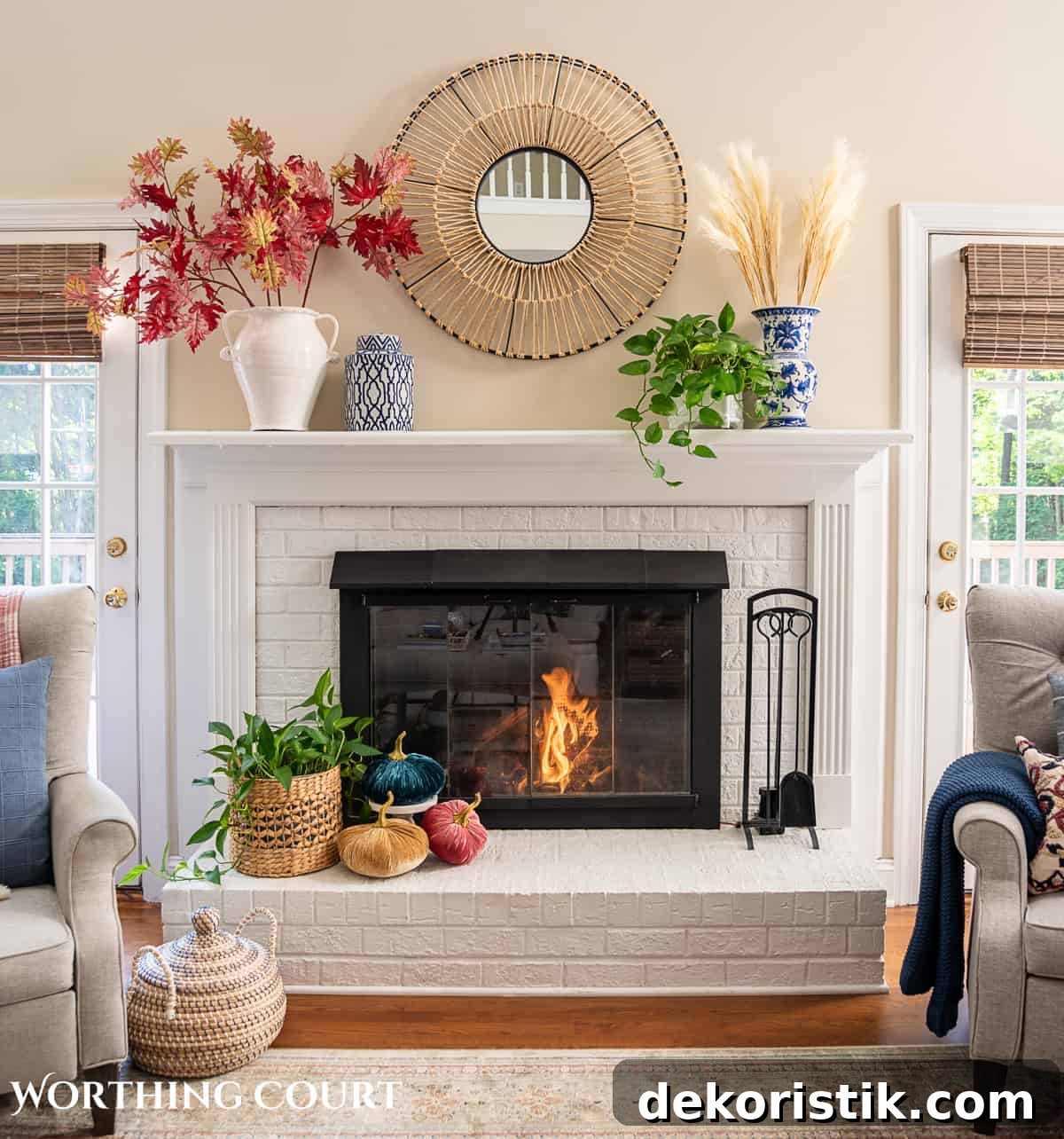 fall decorations on a white brink fireplace and mantel