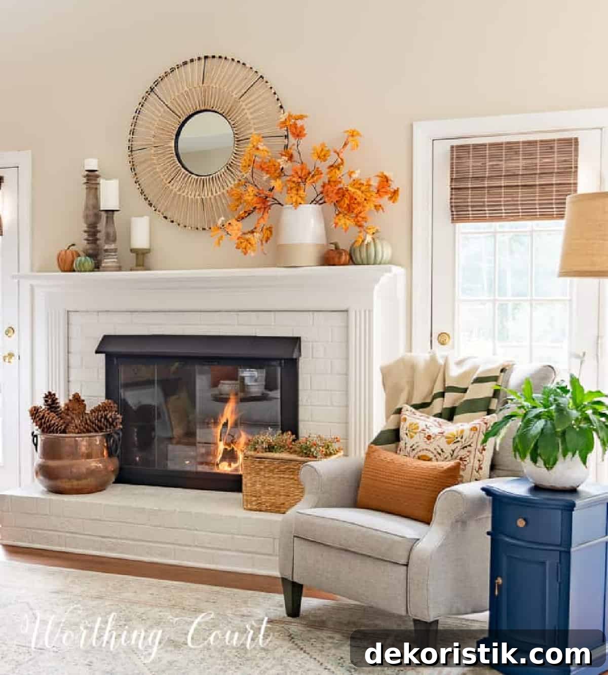 fall decorations on a white brink fireplace and mantel