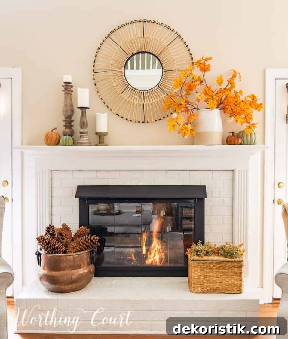 fall decorations on a white brink fireplace and mantel