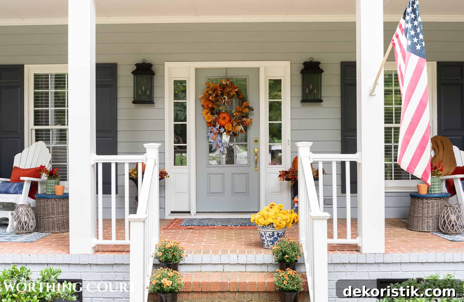 brick steps leading up to a large front porch decorated for fall