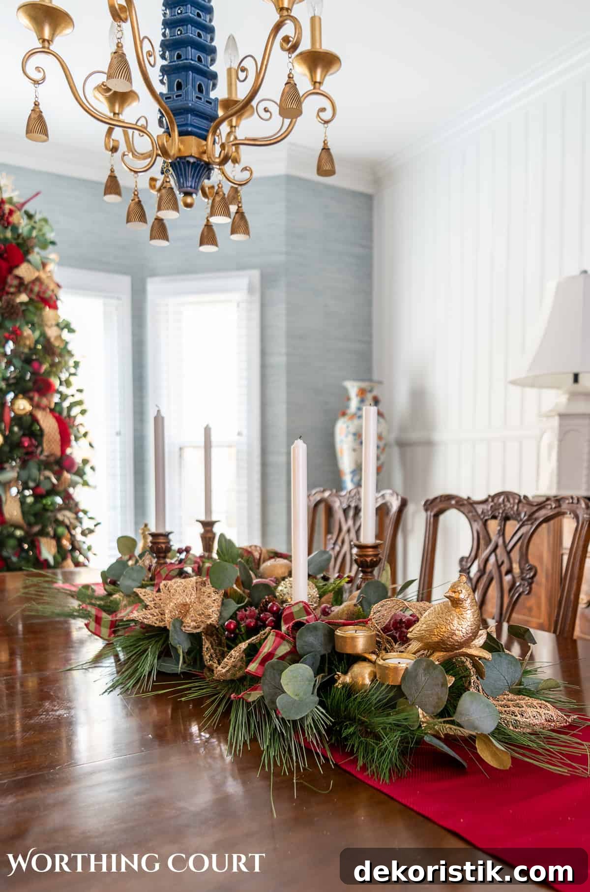 Elegant Christmas Dining Table Centerpiece Ideas 15 An elegant, but easy Christmas centerpiece made with faux greenery and sugared fruit swags. Includes green, burgundy and gold ribbon, gold candlesticks and white candles.