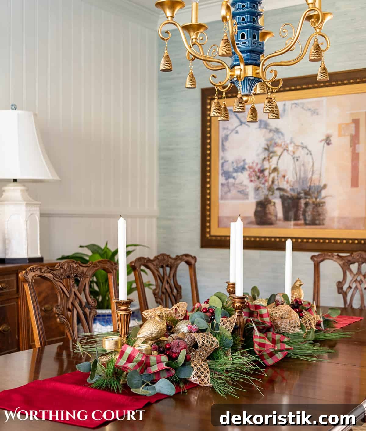 Elegant Christmas Dining Table Centerpiece Ideas 16 An elegant, but easy Christmas centerpiece made with faux greenery and sugared fruit swags. Includes green, burgundy and gold ribbon, gold candlesticks and white candles.