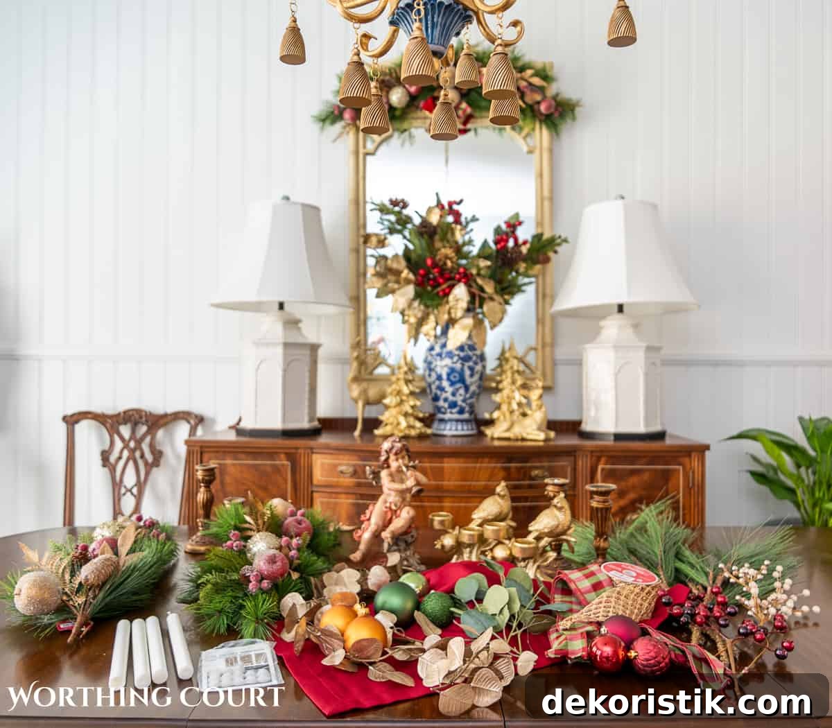 Elegant Christmas Dining Table Centerpiece Ideas 7 An elegant, but easy Christmas centerpiece made with faux greenery and sugared fruit swags. Includes green, burgundy and gold ribbon, gold candlesticks and white candles.