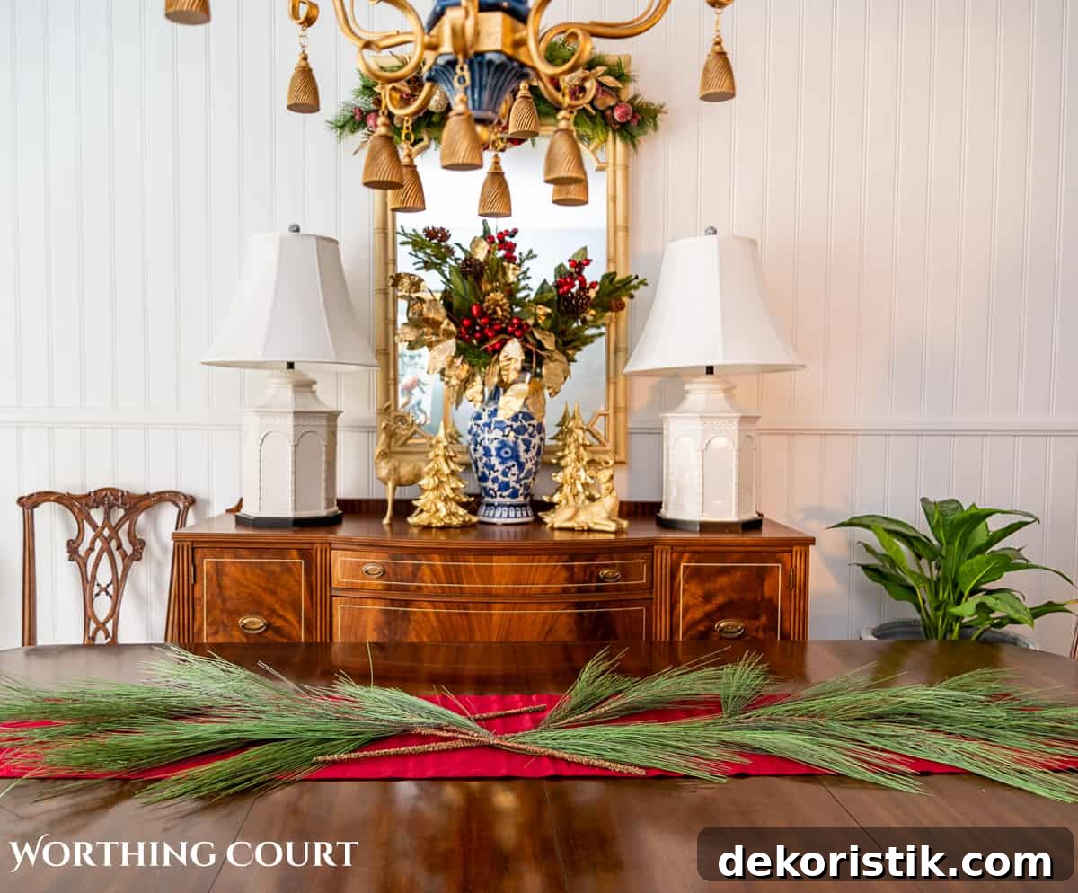 Elegant Christmas Dining Table Centerpiece Ideas 8 An elegant, but easy Christmas centerpiece made with faux greenery and sugared fruit swags. Includes green, burgundy and gold ribbon, gold candlesticks and white candles.