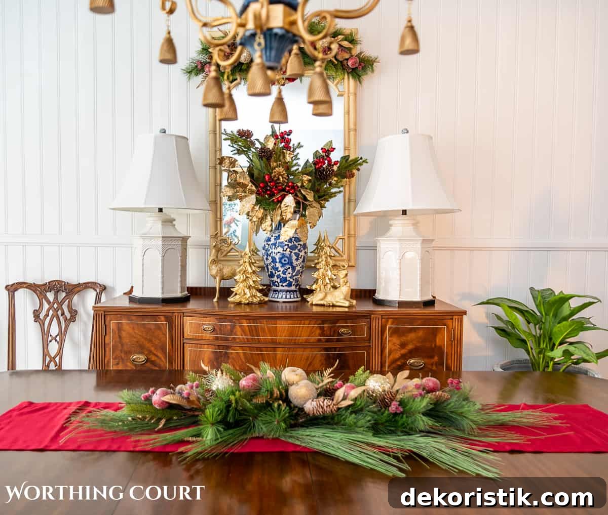 Elegant Christmas Dining Table Centerpiece Ideas 9 An elegant, but easy Christmas centerpiece made with faux greenery and sugared fruit swags. Includes green, burgundy and gold ribbon, gold candlesticks and white candles.