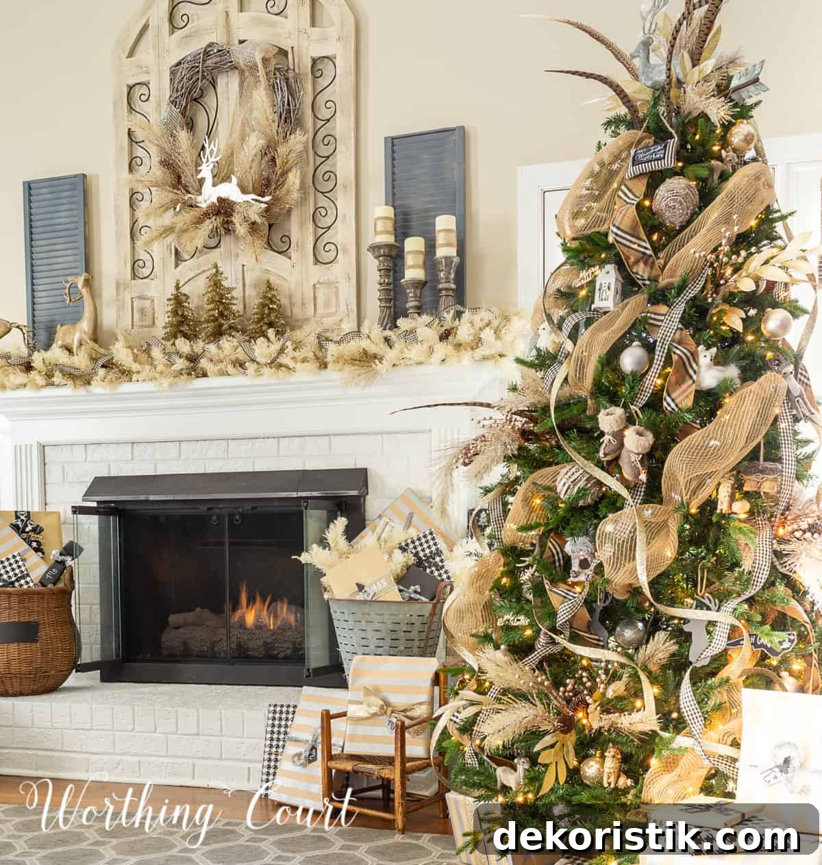 Christmas tree and fireplace decorated with gold and silver decor