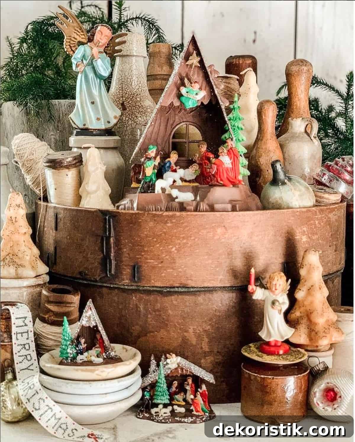 vintage nativity set displayed on and around vintage round wood cheese boxes