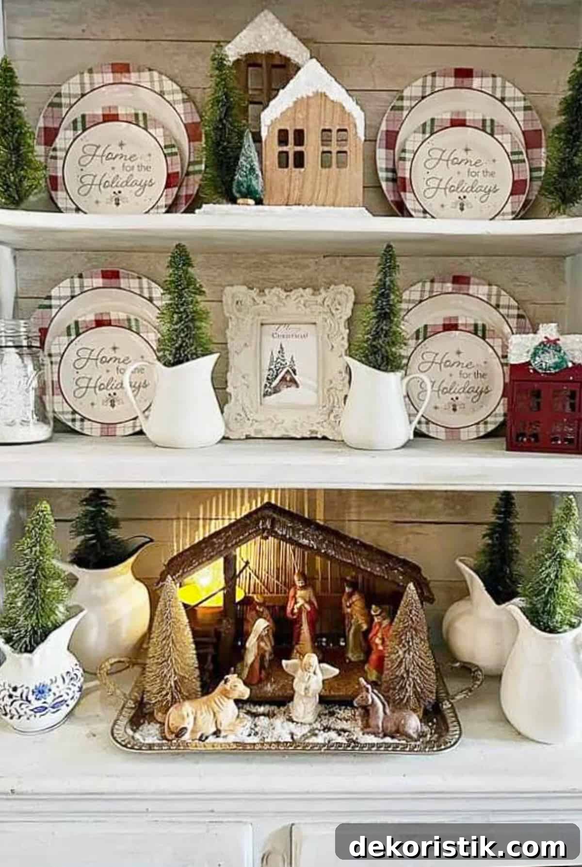 nativity set in a creche on shelves filled with plates