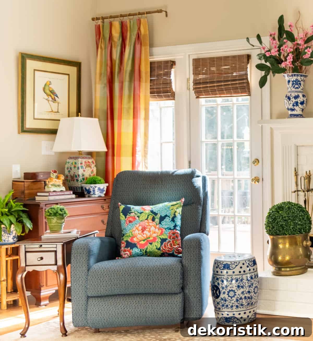 living room decorated in new traditional style with blue recliners, wood tables, colorful accessories and a faux antelope area rug