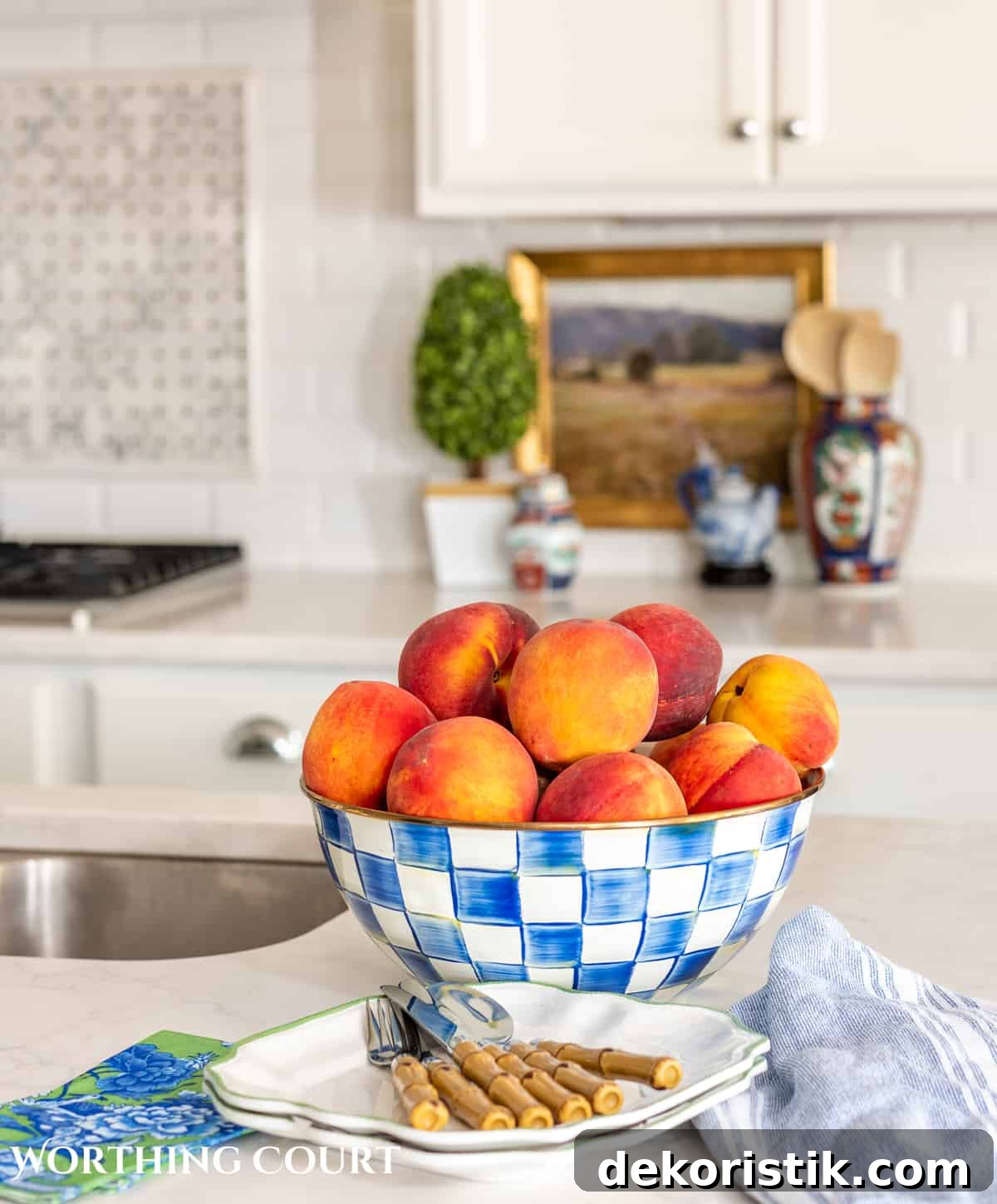 peaches in a blue and white bowl on a kitchen island