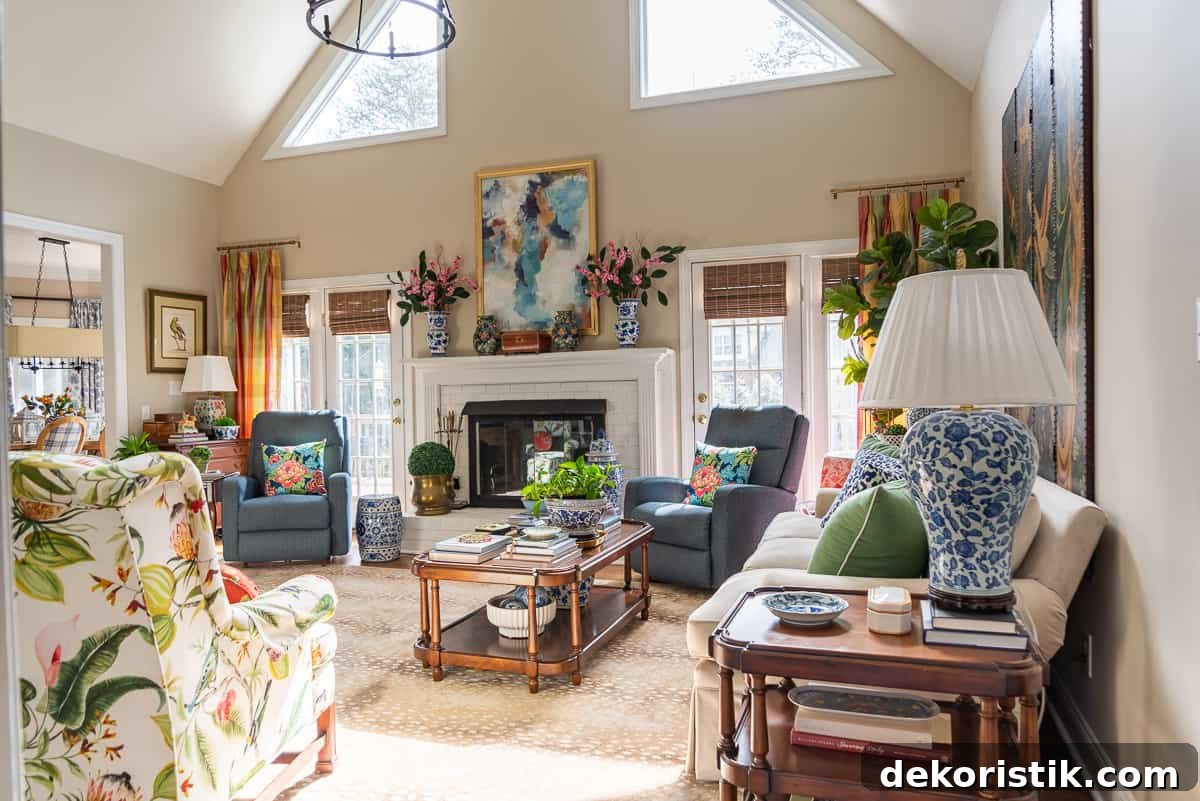 fireplace in a living room decorated in new traditional style with blue recliners, wood tables, colorful accessories and a faux antelope area rug