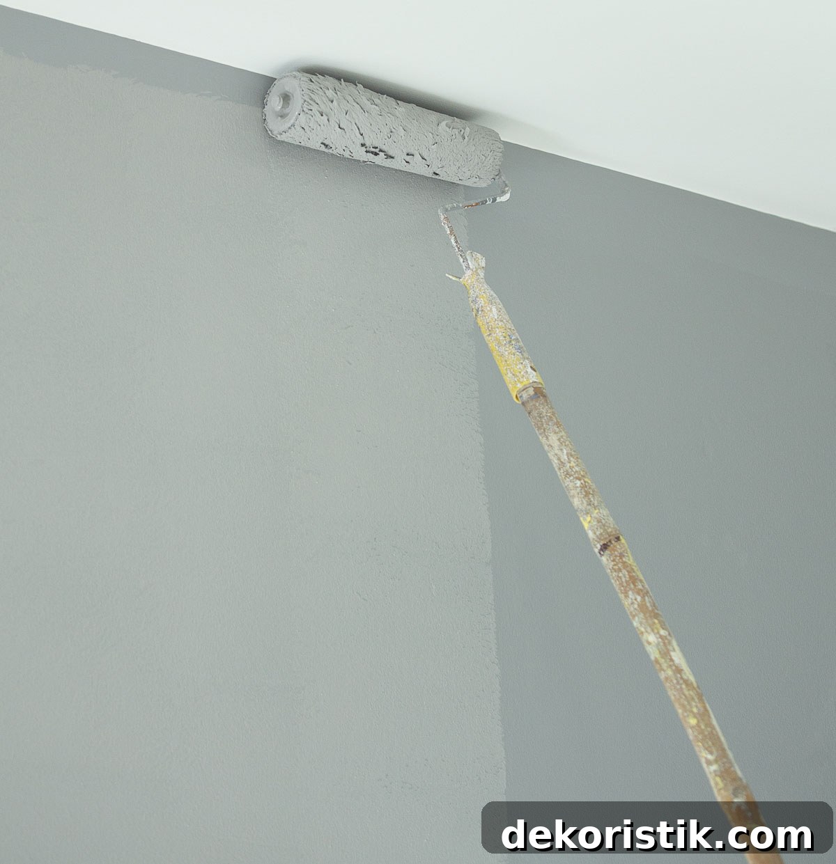 gray wall with 1/2 of it wet and 1/2 of it dry