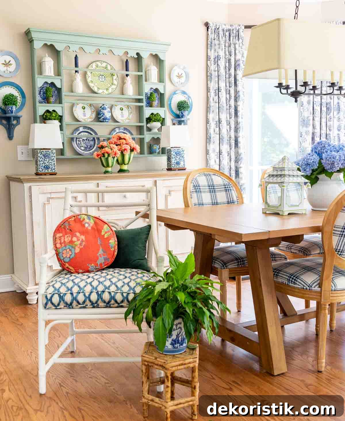breakfast room with a large bay window decorated for summer