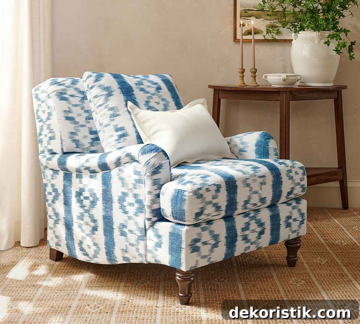 armchair upholstered with blue and white striped fabric