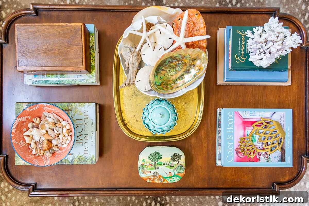 wood coffee table with colorful summer accessories and coffee table books