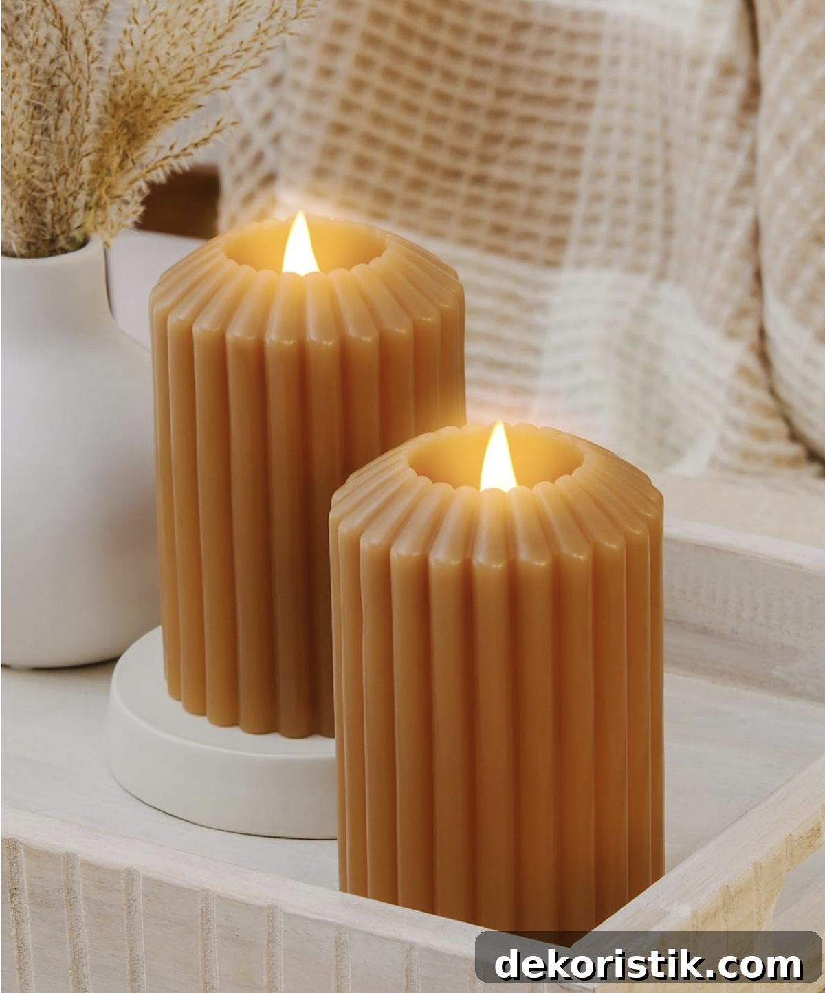 Flameless candles on a table creating warm fall ambiance