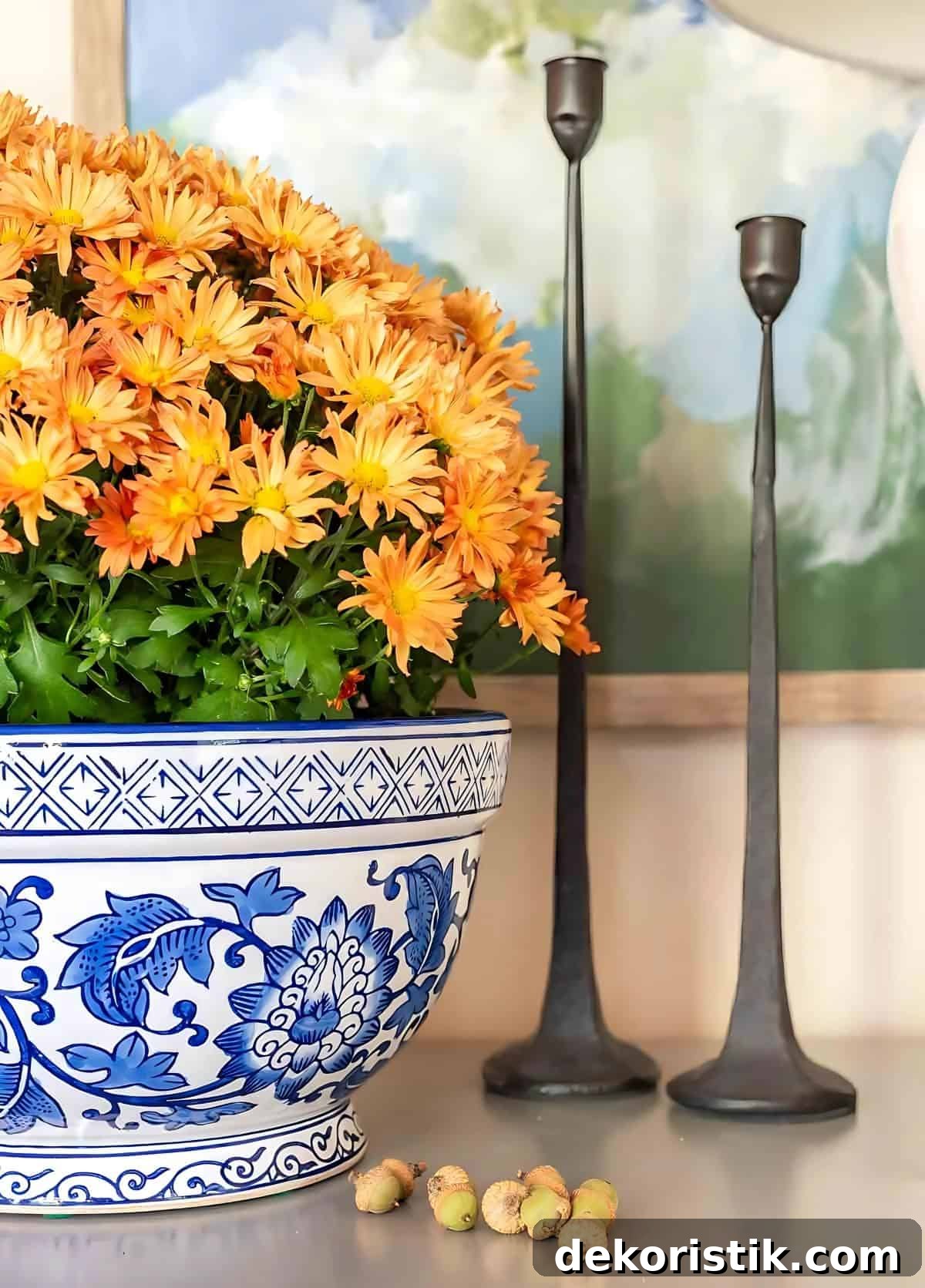 bronze mums in a blue and white bowl