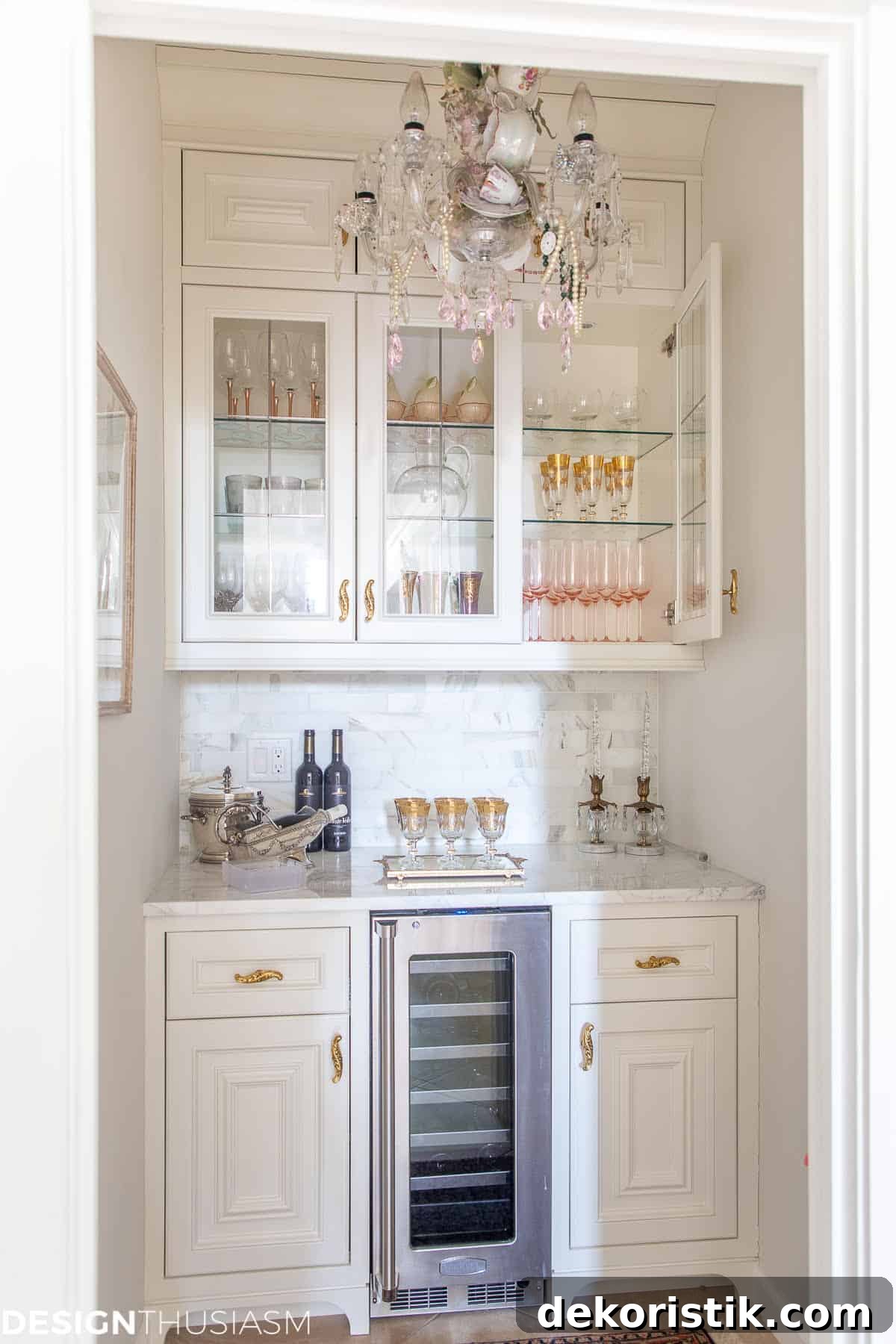dry bar area with white cabinets and a mini fridge
