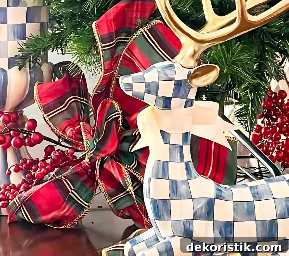 blue and white sitting deer in front of a red plaid Christmas bow