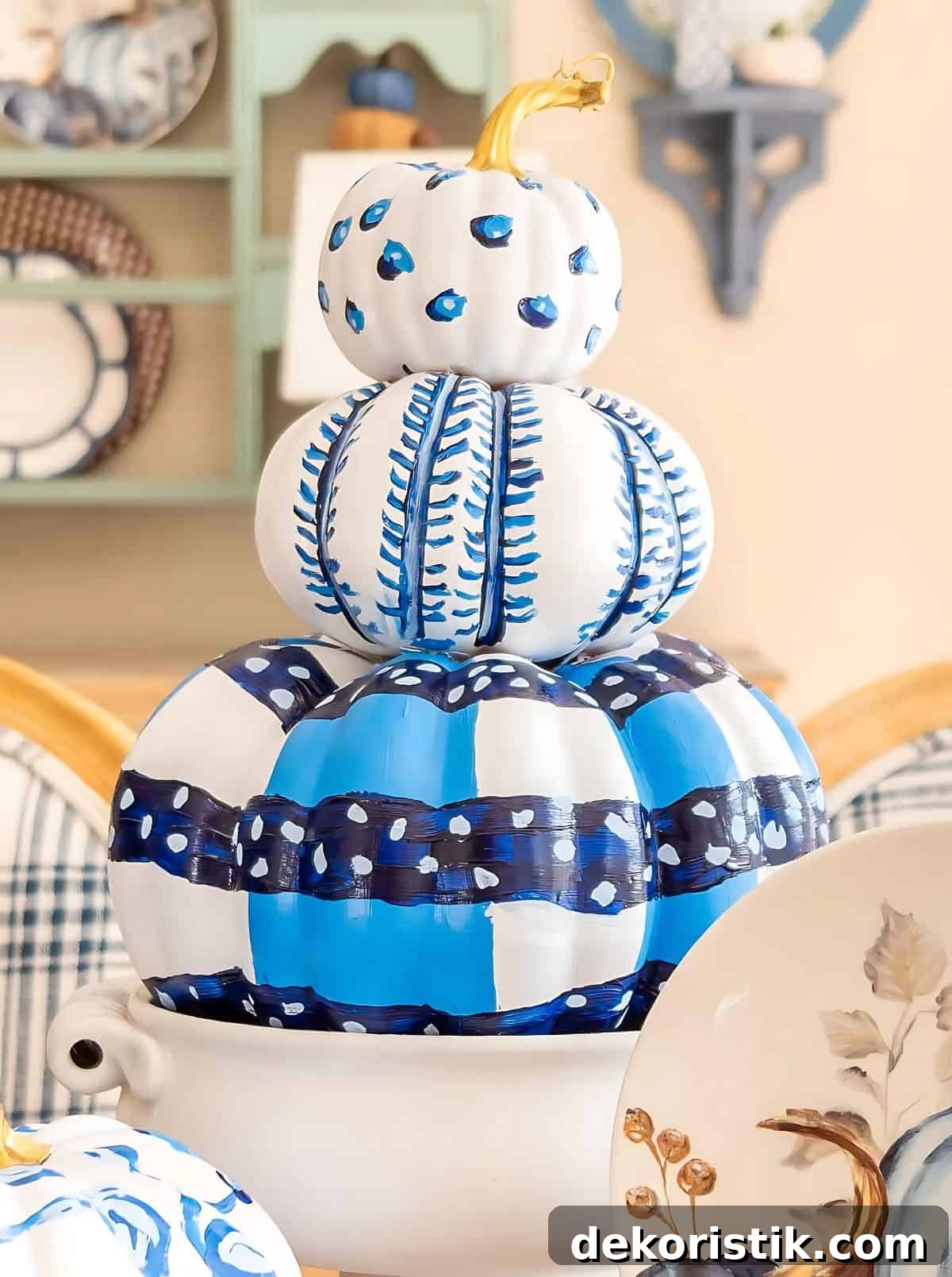DIY Painted Pumpkin Centerpiece Ideas for Fall Decor 10 blue and white DIY painted pumpkins used as a centerpiece