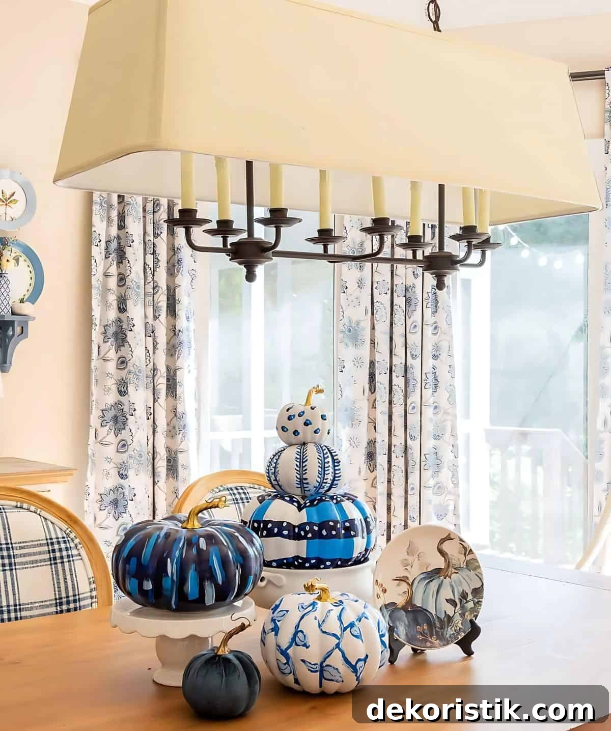 DIY Painted Pumpkin Centerpiece Ideas for Fall Decor 3 blue and white DIY painted pumpkins used as a centerpiece