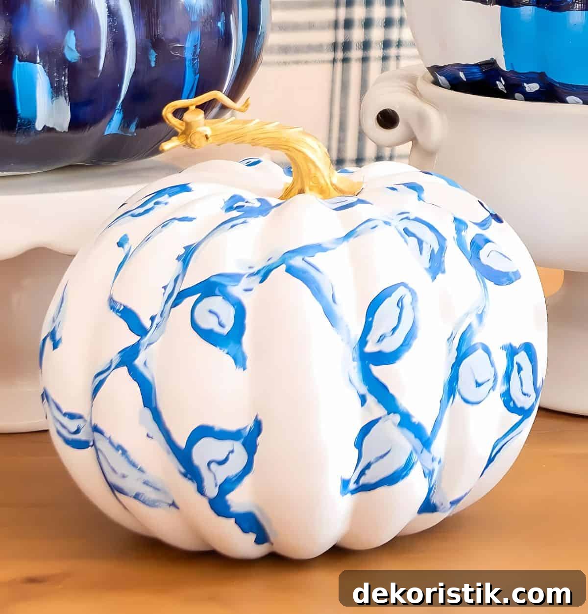DIY Painted Pumpkin Centerpiece Ideas for Fall Decor 8 blue and white DIY painted pumpkins used as a centerpiece