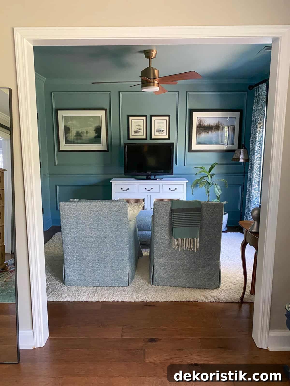 small tv room with slate blue walls