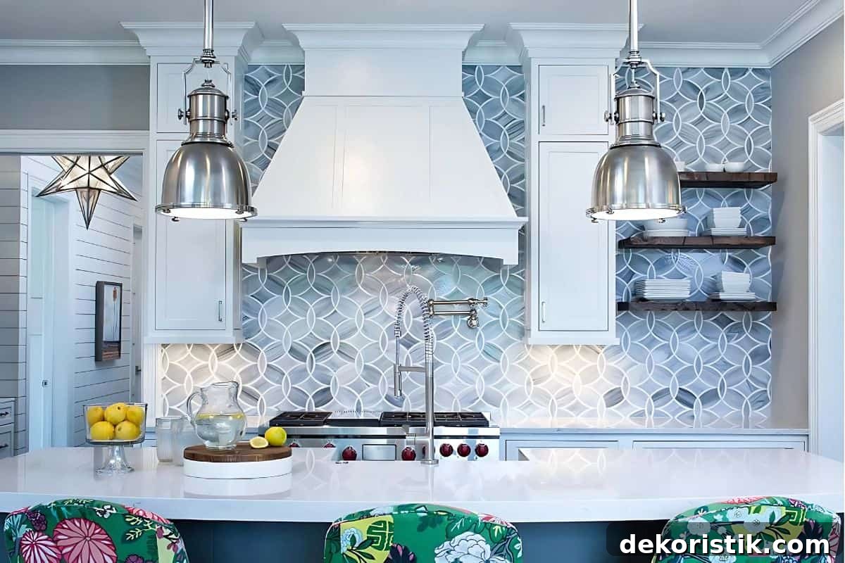 stove wall of a kitchen with white cabinets and a blue and white geometric backsplash