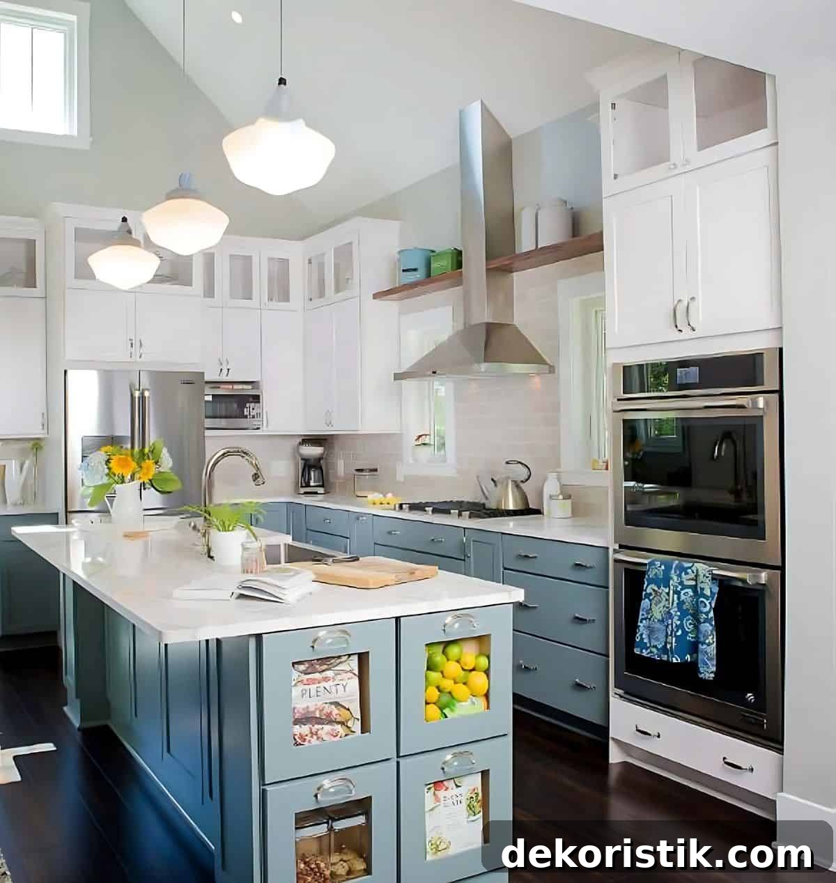 large kitchen with white upper cabinets and blue lower cabinets