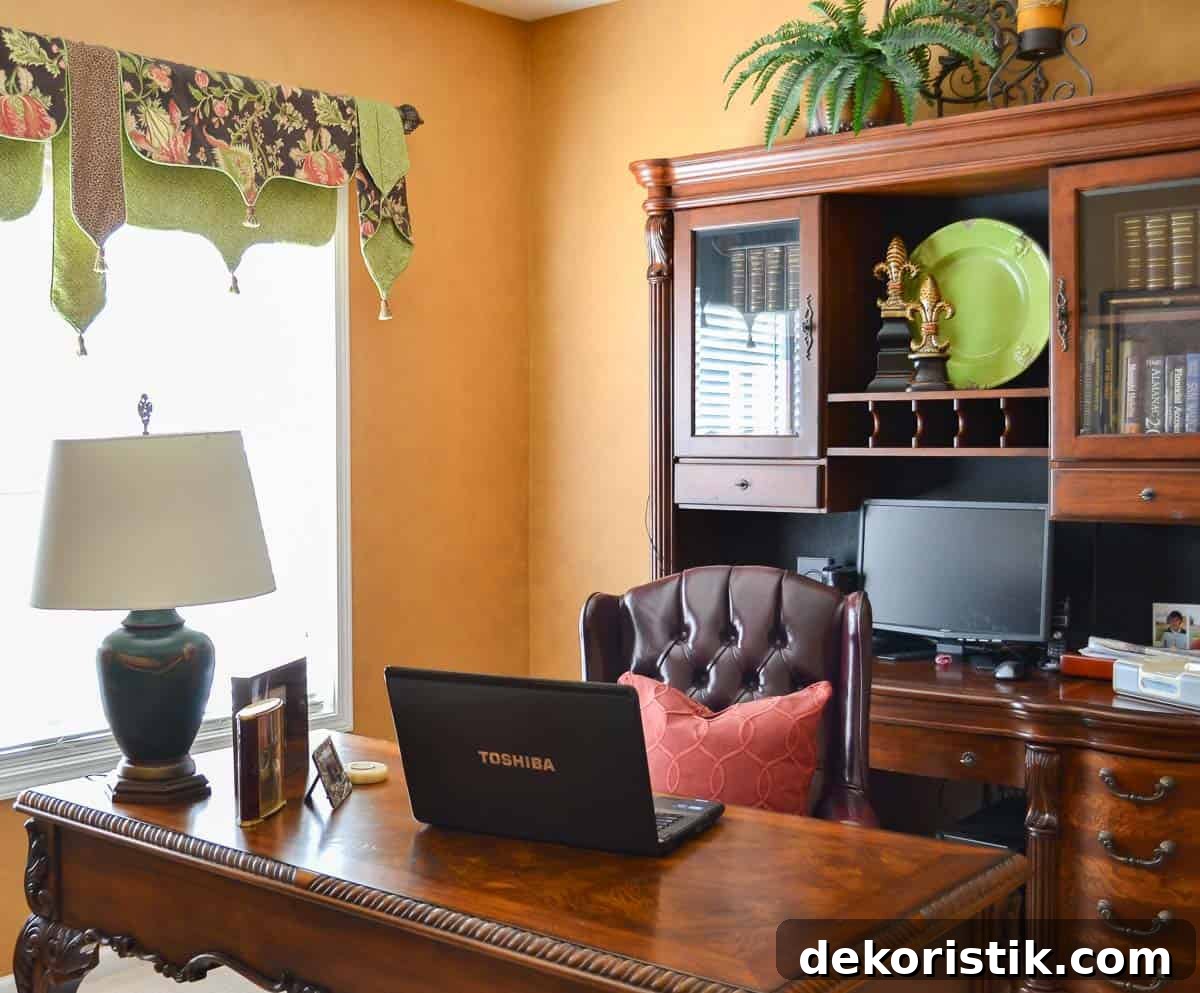 home office with side chairs, desk, file cabinet decorated with gold, green and red