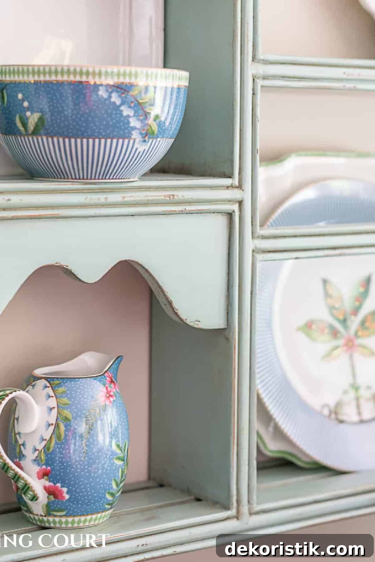 partial image of decorative plates on a plate rack