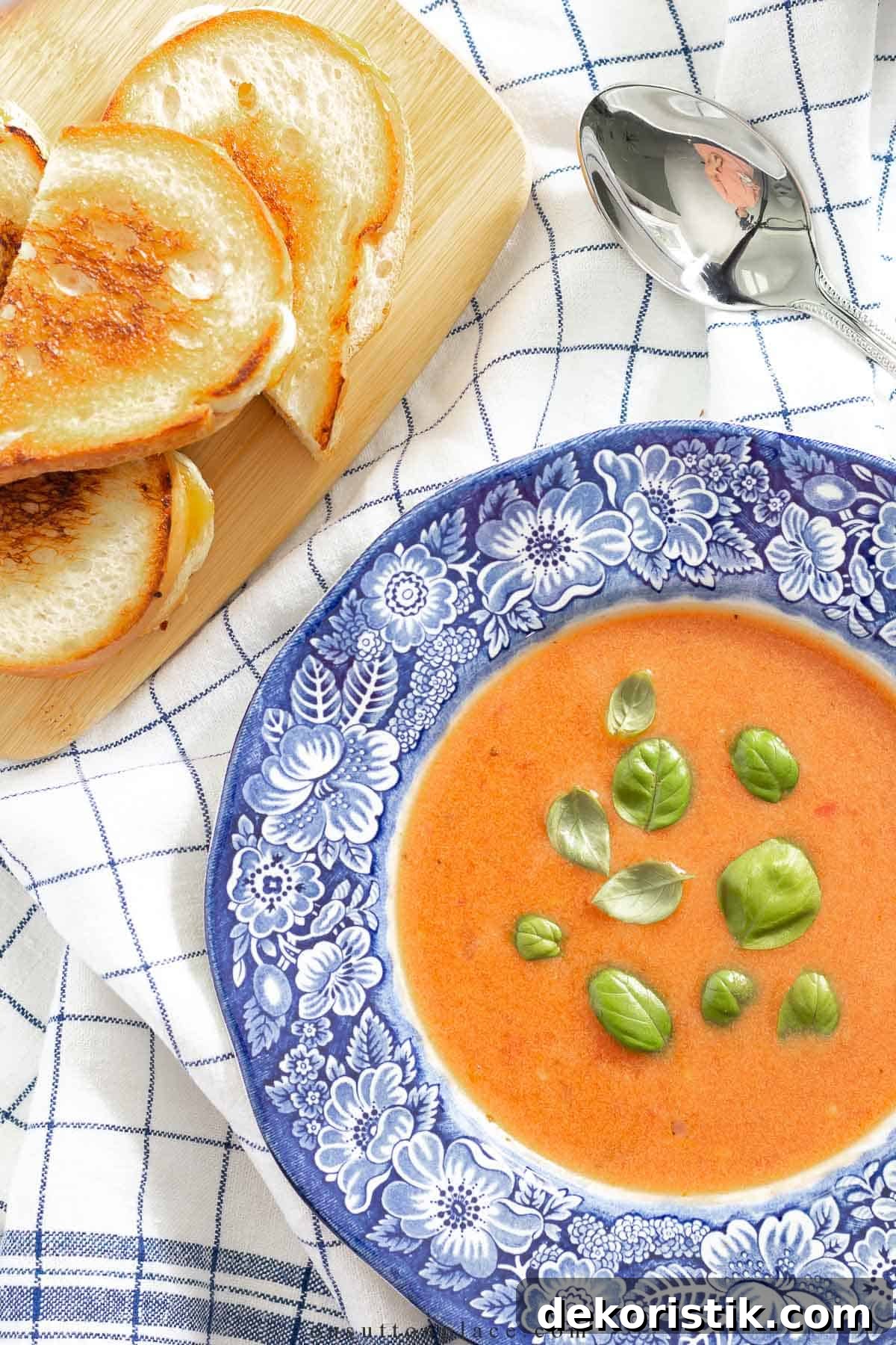 Cream of tomato soup in a blue-and-white rimmed bowl