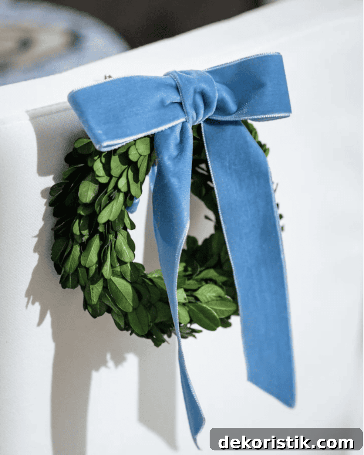 preserved boxwood wreath with dusty blue velvet bow