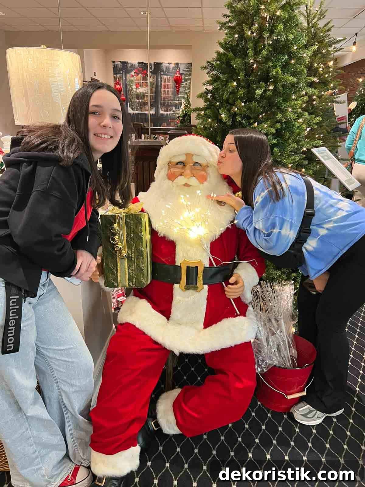 Weekly Muse Issue 26: Creative Trends and Curated Picks 3 2 girls pretending to kiss a Santa figurine
