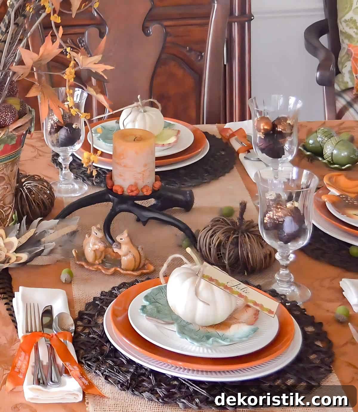 Bountiful Thanksgiving tablescape set with a variety of fall and traditional Thanksgiving colors and elements