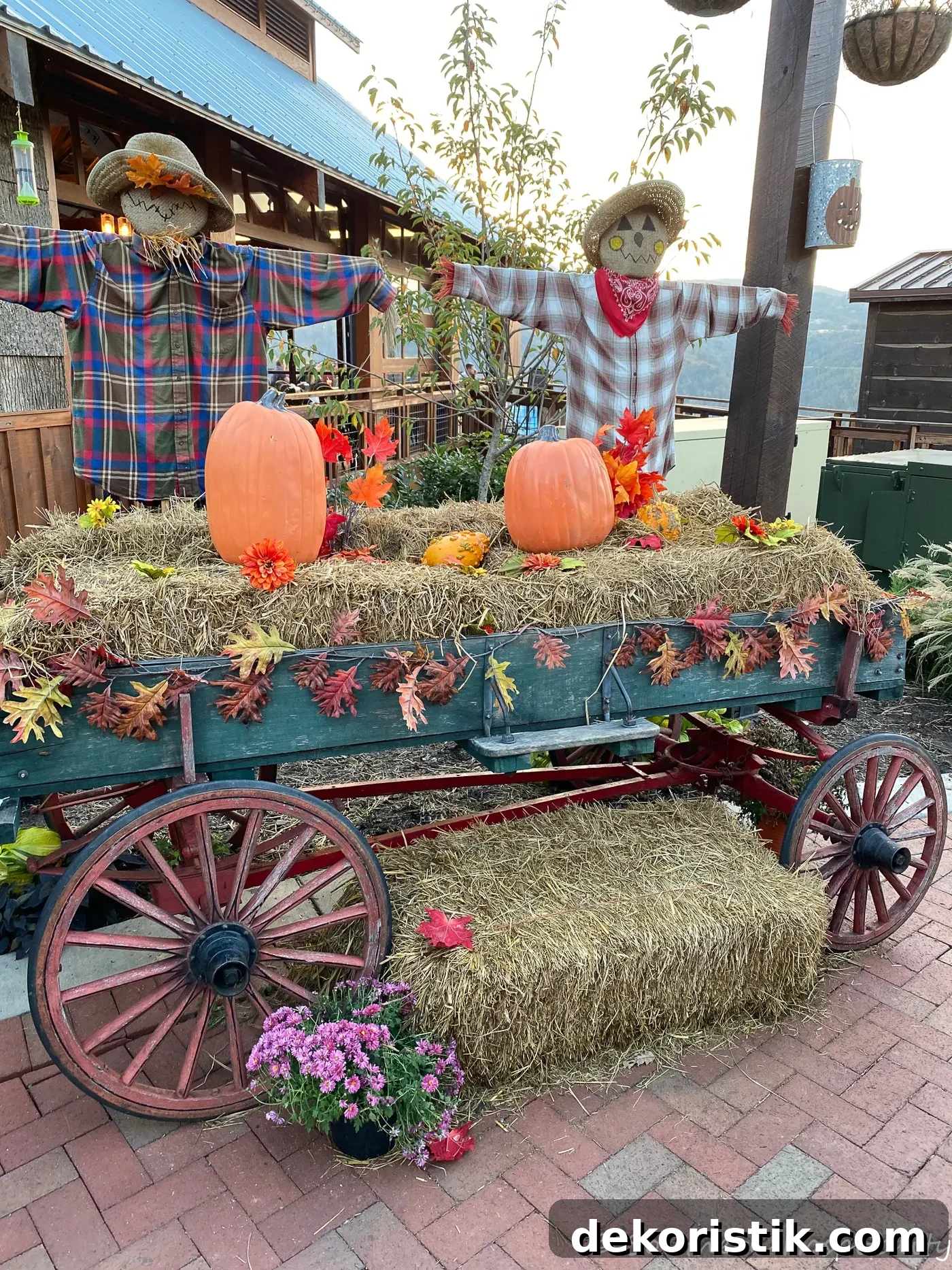 wagon with bales of hay and pumpkins on it