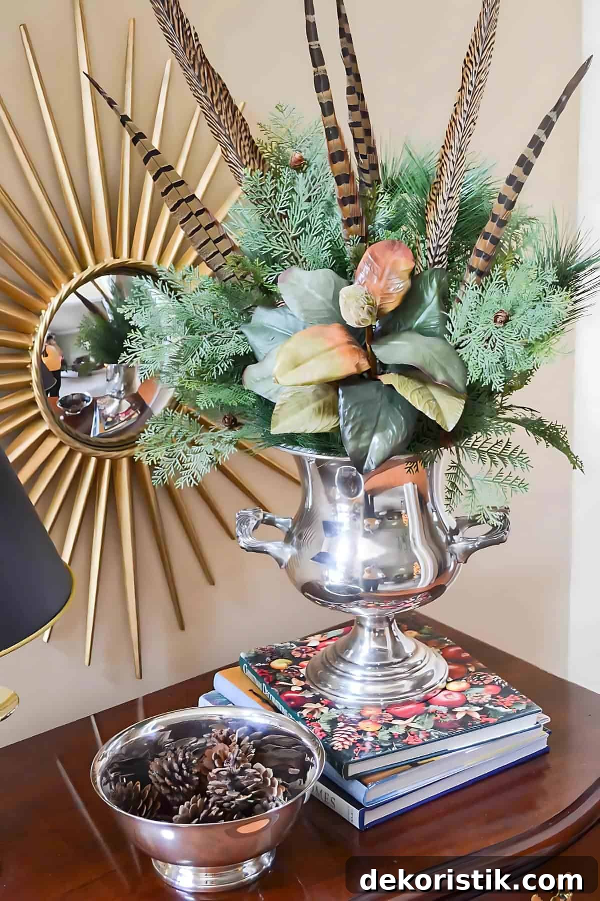 Christmas Vignette Ideas to Elevate Your Holiday Decor 11 silver champagne bucket filled with Christmas greenery and feathers