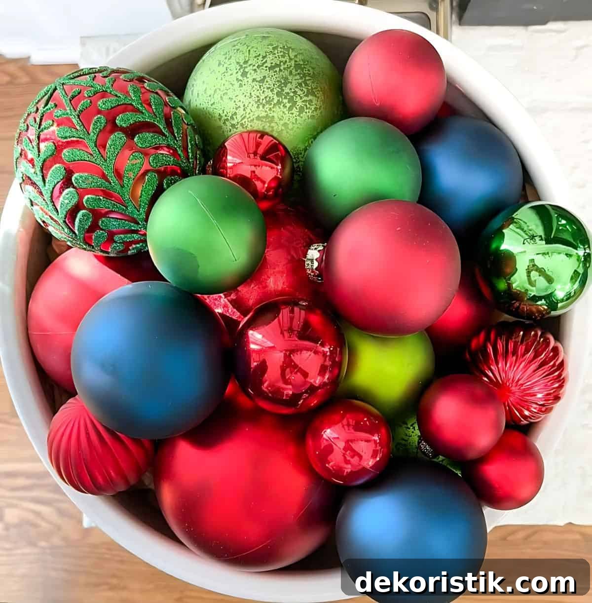 Christmas Vignette Ideas to Elevate Your Holiday Decor 8 overhead view of large bowl filled with multiple colors of Christmas ornaments